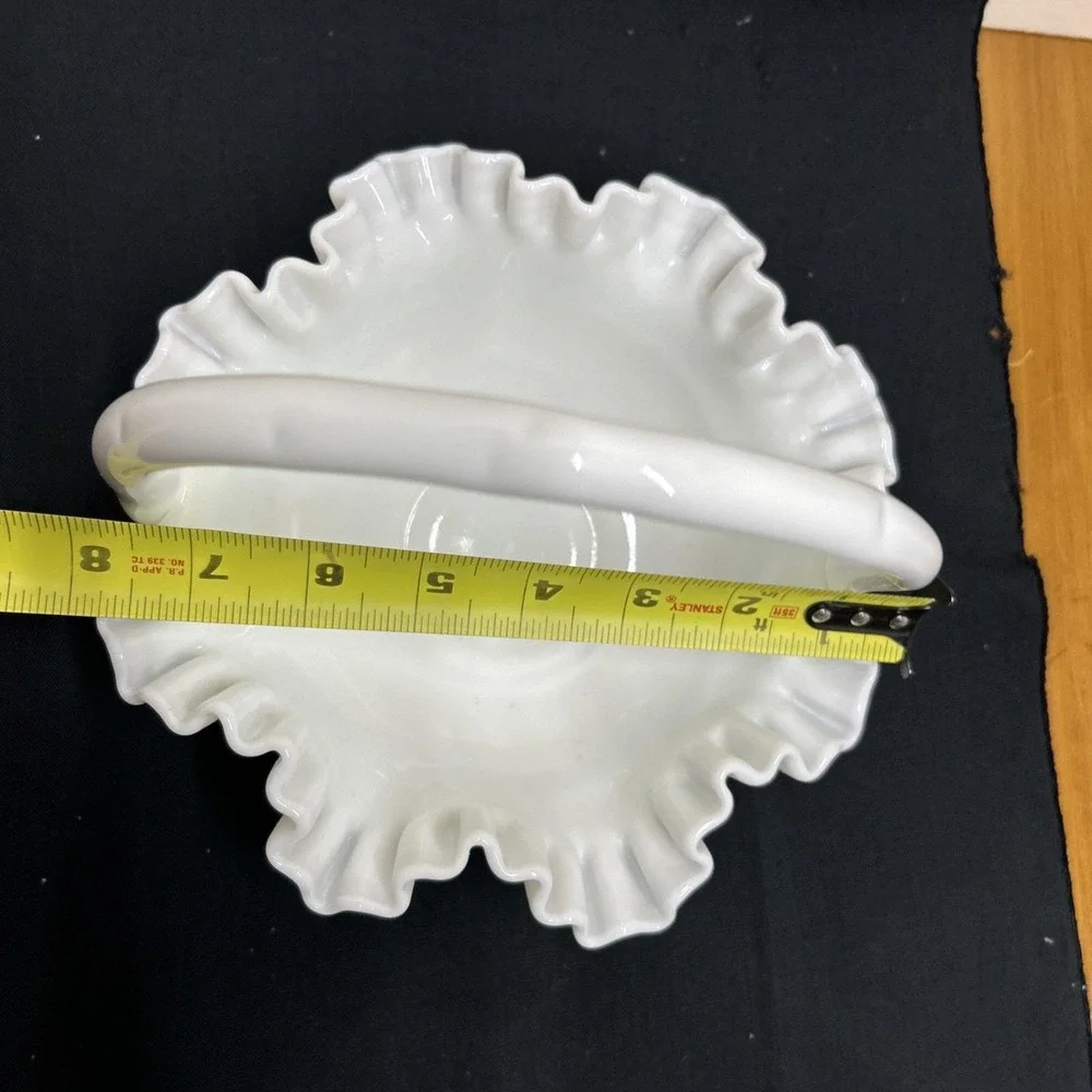 Vintage Fenton Hobnail White Milk Glass Basket with a ruffled edge and handle